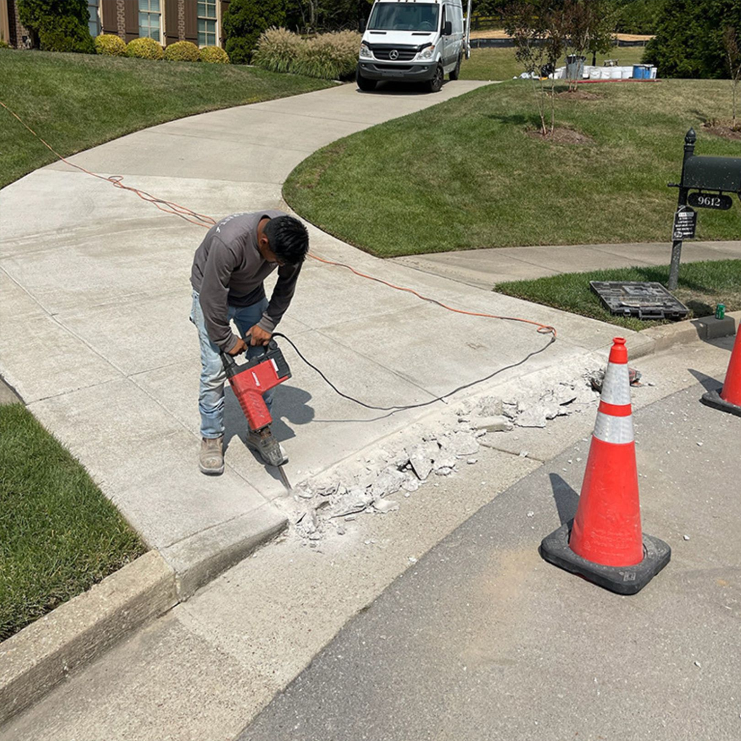 Driveway cut excavation and road sub-base preparation